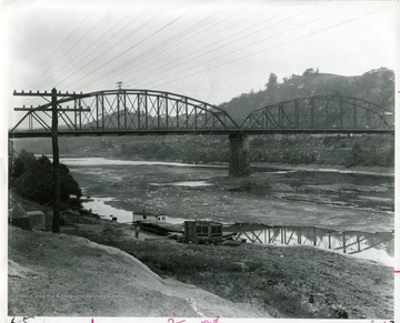 'Many Morgantown residents can remember walking across the dry river bed during the 1930 drought.'  Morgantown and Westover bridge visible.
