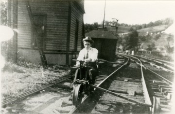 Andrew Rush rides a hand operated rail cycle, also known as a velocipede, at the Chesapeake &amp; Ohio Depot.