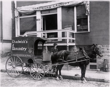 Chadwick's laundry wagon on Chestnut Street, Morgantown; the wagon is parked in front of the building for Chadwick's Laundry.