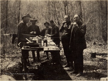 Timber crusing (estimating) prior to purchase of the 7,600 Acre tract, known as the Ranwood Lumber Company Tract, on Sugar Creek and Back Fork of Elk, Webster County.  CH Holden, Ranwood Lumber Company;  C.W. Sprinkle, Atlas Lumber Company;  EM Bonner, Atlas Lumber Company; and Dave Cogar, woods boss.
