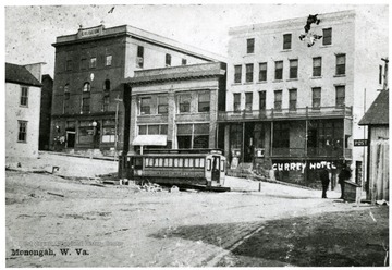 Picture of a intersection of streets in Monongah, W. Va. 1907.  Trolley car in the foreground.