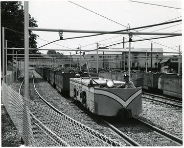 Miner driving an electric locomotive in a Consol Coal Yard in W. Va. 