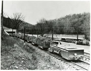 Filled coal carts leaving the Mathies Mine enroute to the Pittsburgh Consolidation Coal Co. Preparation Plant. Copy Print by 'Judge' of good pictures, 954 Liberty Ave. GR. 1-4288. AT. 1-3834.
