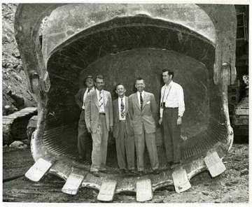 Five men standing in the Mountaineer Scoop.