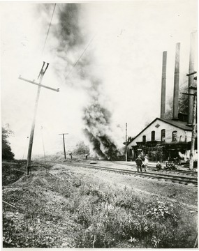 Caption on back reads, 'Fire in the ventilation system or fan house of the Gaston Mine, 1912.  This mine was opened by James Otis Watson in 1874. Located at Watson and closed in 1925. It was located in what is now the present boundary of the friendly city of Fairmont.'