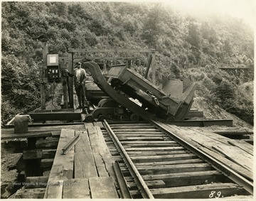 Miner operating a loading machine outside of a mine.