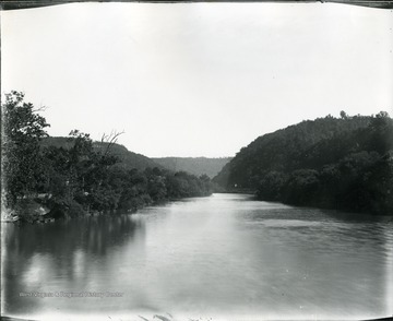 View of Greenbrier River from bridge at Alderson.  Road visible in the distance.  