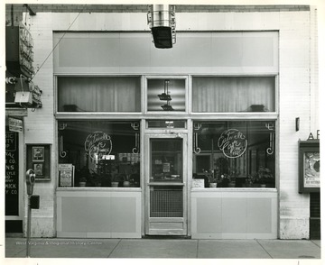 View of the entrance to the Eatwell Cafe in Beckley, West Virginia.  'Copyrighed 1955 All rights reserved by Harlow Warren 320 North Kanawha Street Beckley, W. Va.'