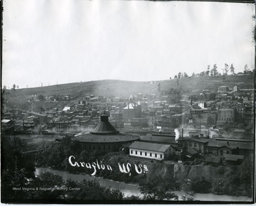 View of Grafton with river, roundhouse, and train tracks present.