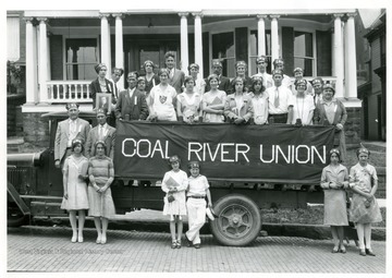 Members of the Coal River Union pose in and around their float in Grafton, West Virginia.