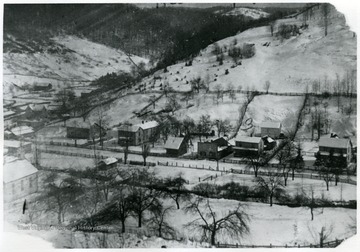 Snowy view of Helvetia, W. Va.  Numbered spots:  1) church 2) Huber hotel 3) parsonage.