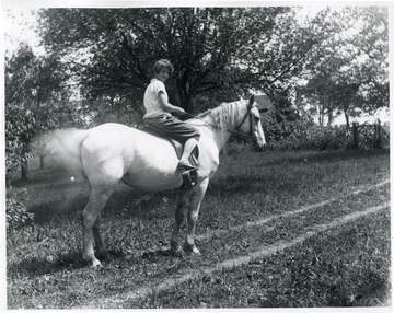 Olga Aegerter Holtkamp's daughter, Grace, on horseback.  Helvetia, W. Va.