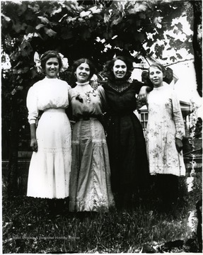 Four young women standing together under a tree, Helvetia, W. Va.