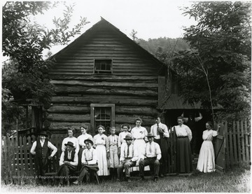 The Burky family posed for a portrait outside their cabin on Turkeybone Mountain.