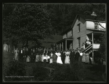 Wedding party standing near a farmhouse in Helvetia, West Virginia.