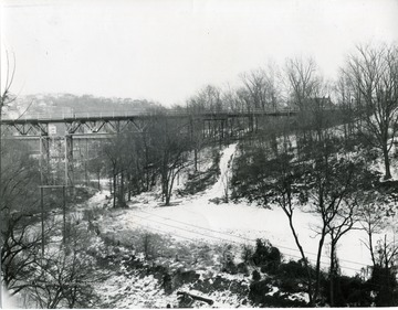View of Deckers Creek and the Walnut Street bridge on a snowy day.