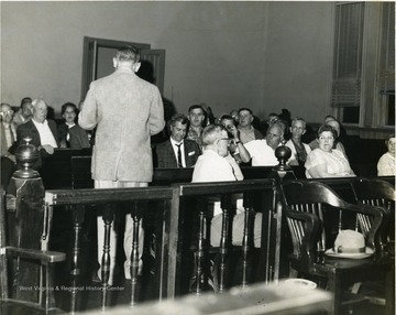 William Delardas giving addressing crowd in the old court room in Morgantown, W. Va. 