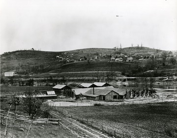'West brickyard looking toward north Morgantown Hill, showing a part of Sunnyside, an uninhabited Wiles Hill, and Lough Brothers Carriage Factory on the west side of Beechurst.'