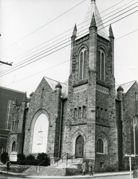 Wesley Methodist Church located on Willey Street near the campus of West Virginia University in Morgantown, W. Va.  People seen near the Church. 