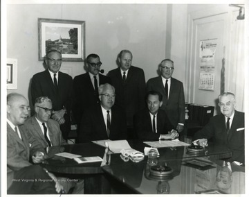 Group portrait of Richard Hamstead, Joel Hanna, Bill Leyhe, Bob Burchsul, and Mayor Arthur W. Buehler and others in photograph.