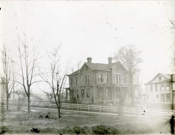 'The Tom Evan's house on the south side of Willey east of Spruce [Street], showing the Phi Kappa Psi House. Now the Cop Hatfield property.' 