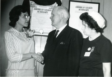 Congressman Harley Staggers seen with members of the American Legion Auxiliary. 'Woman on right is Marguerite Hess.' 