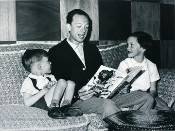 Don Knotts reading a story with his children. 
