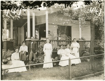 'A group of five ladies and one gentleman at some residence.  Probably the Maderia house at the intersection of Beverly Ave. and University Driveway.'