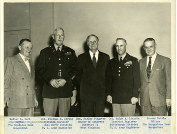 A group portrait of five men. Left to right: 'Walter L. Hart, Editor, The Dominion News, Morgantown; Col. Paschal N. Strong, Division Engineer Ohio River Division, U.S. Army Engineers; Hon. Harley Staggers, Member of Congress District II West Virginia; Col. Ralph A. Lincoln, District Engineer, Pittsburgh District U.S. Army Engineers; and Brooks Cottle, Editor The Morgantown Post.'