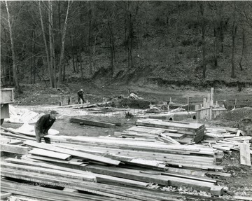 Men working on a subterranean bridge over Decker's Creek at Marilla.