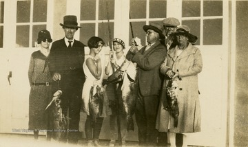 A group photo of Isaac Ballard and his family, and the fish they caught in Florida. Left to Right: 'Ma, Pop, Catherine, Jorine, Davy, Mac, Mrs. Brown.'