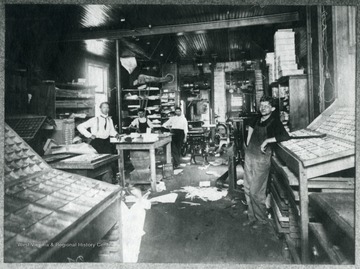 Four employees in W.W. Logan's Print Shop (Back of Welch Daily News Building.)