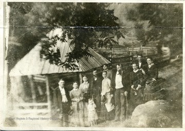 "Picture copied from tintype.  This picture was taken at Webster Springs during the summer of 1883.  The three in the front row are Davy Byers and wife and Frank L. Johnson.  Isaac V. Johnson and wife and J.M. Woodford are in second row.  I do not know the lady on father's right and in rear of mother.  I do not know the two ladies and gentleman in rear.  Who knows the ones not known to me?"  L. Johnson  "The lady on father's right is Miss Albina Morrall, daughter of L.D. Morrall, of this place.  The lady in the rear of mother is Miss Anna Manley, probably from Marion County.  The one to the left of J.M. Woodford is his wife, and the two back of Mrs. Woodford are William Robinson and his daughter, Miss Mollie.  William or "Uncle Billy" as we all knew him, was the father of Judge Ira E. Robinson, now on the radio board of the nation."  A.S. Poling