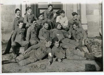 'The first University Football Team, 1891. left to right on ground: N.B. Blake and George M. Ford; lower step (south side Martin Hall) George H.A Kunst, Andrew Price, J.W. Hughes, R.F. Bivens, J.T. Holbert; upper row: William C. Meyer (manager), A. Brown Smith, William G. Swaney, Gory Hogg, A.E. Boyd, and S.R. Jenkins.'