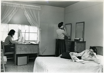 Three women in room at Arnold Hall.