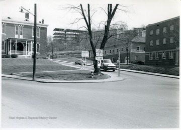 After 1957. WVU campus buildings from left to right, Agricultural Experiment Station, North Wing of Terrace (Dadisman) Hall under construction, Women's (Stalnaker)Hall, Cafeteria, Student Health Center.