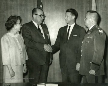 Left to right, Mrs. Wiles, Dr. Wiles, Dr. Harry Heflin, Colonel Reynolds.