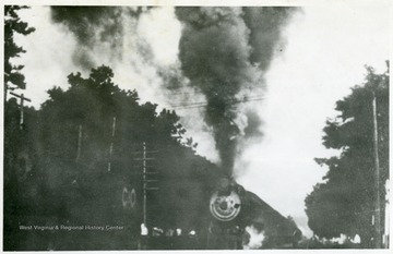 'Chesapeake &amp; Ohio train #4 thunders over the Monroe Street crossing at Alderson, W. Va. in 1909.'