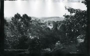 '197.W.83.B.; Looking West from hill side near where a spring is on the under side of rock. Used by village people so generally; August 11, 1884, Monday 3:40 pm'