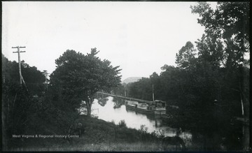 A photograph of a boat floating down a canal. '184.D(109); Aug. 8, Fri. 5:35 p.m.'
