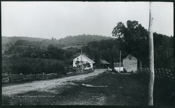 A photograph of a country road with two small buildings standing on either side. '108 D.; Friday Aug. 8, 1884, 5 p.m.'