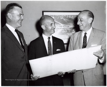 Left to Right - Joseph Allen Overton, Jr., a Parkersburg lawyer at U.S. Dept. of Commerce under Eisenhower administration, Senator John D. Hoblitzell, Jr. and Louis S. Rothschild under the Secretary of Commerce for Transportation. Overton later became a president of the American Mining Congress.  They may well have been met to discuss the routing of West Virginia's first interstate.