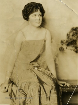 Miss Frances D. Packette posing in evening wear.