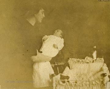 Anna Mathers holding her newborn grandson, George.